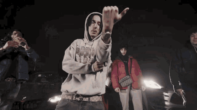 a man wearing a hoodie that says ' hooded ' on it