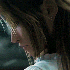 a close up of a woman 's face with a white shirt on
