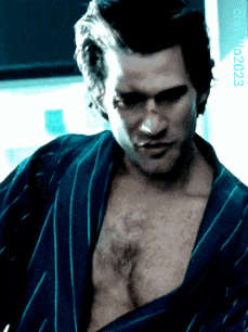 a man in a striped robe has the number 023 on the bottom right