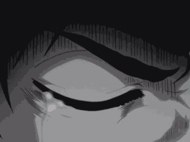 a close up of a person 's face with tears running down their face .