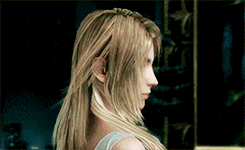 a woman with long blonde hair is standing in front of a sign that says ' e ' on it