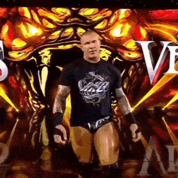 a wrestler wearing a black shirt with a dragon on it