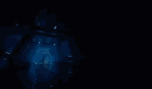 a dark room with a blue light coming out of it
