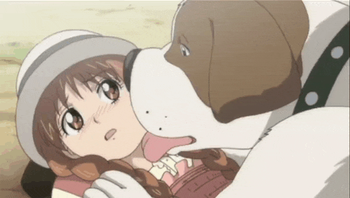 a little girl is laying on the ground with a dog licking her face