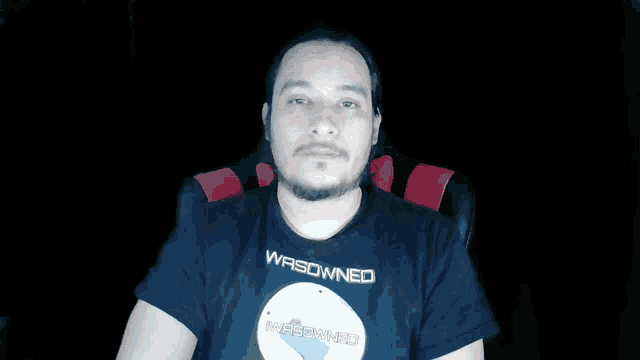 a man wearing a black t-shirt that says wrowned