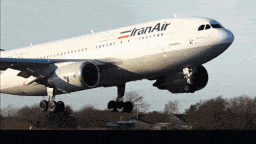 a large iran air plane taking off from a runway