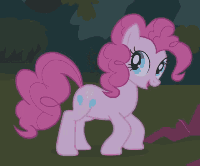 pinkie pie from my little pony is standing on a grassy field