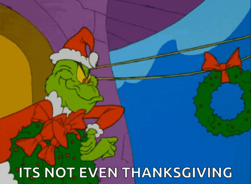 a cartoon of grinch with the words " it 's not even thanksgiving " below him