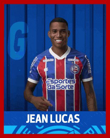 a soccer player named jean lucas is standing in front of a blue wall