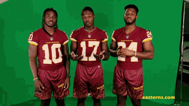 three washington redskins players are posing for a photo on a green screen