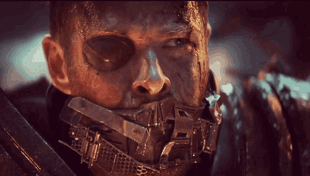 a man with a metal mask on his face