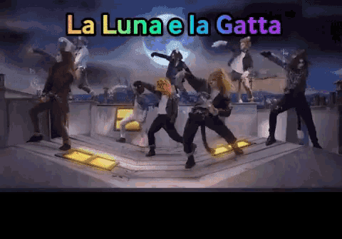 a group of people are dancing with the words la luna e la gatta written above them