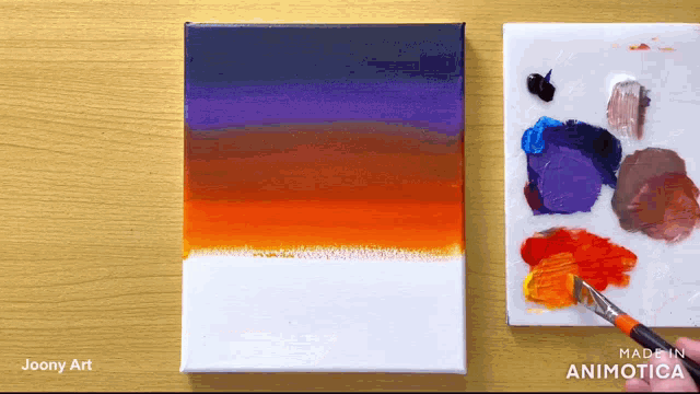 a painting of a sunset is being painted on a canvas