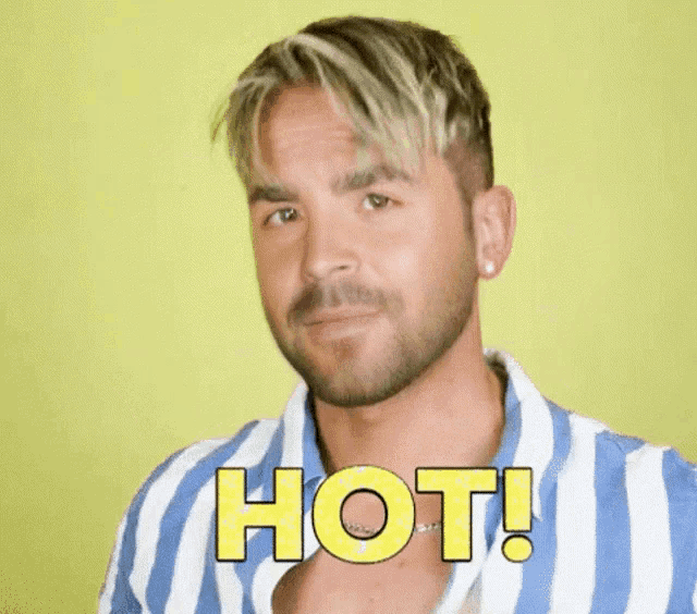 a man with a beard is wearing a blue and white striped shirt and says hot