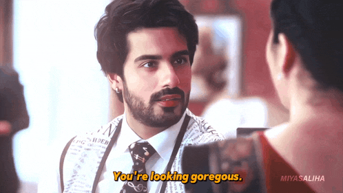 a man with a beard says you 're looking gorgeous to a woman