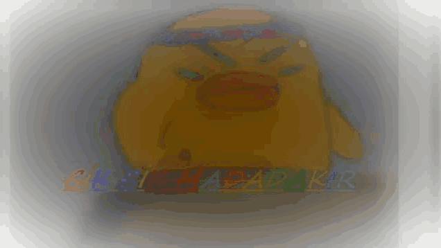 a drawing of a yellow duck with a bandana around its head and the words gk i papakr written below it