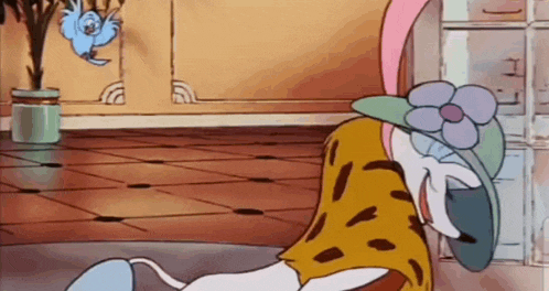 a cartoon character is laying on the floor wearing a hat and a flower .