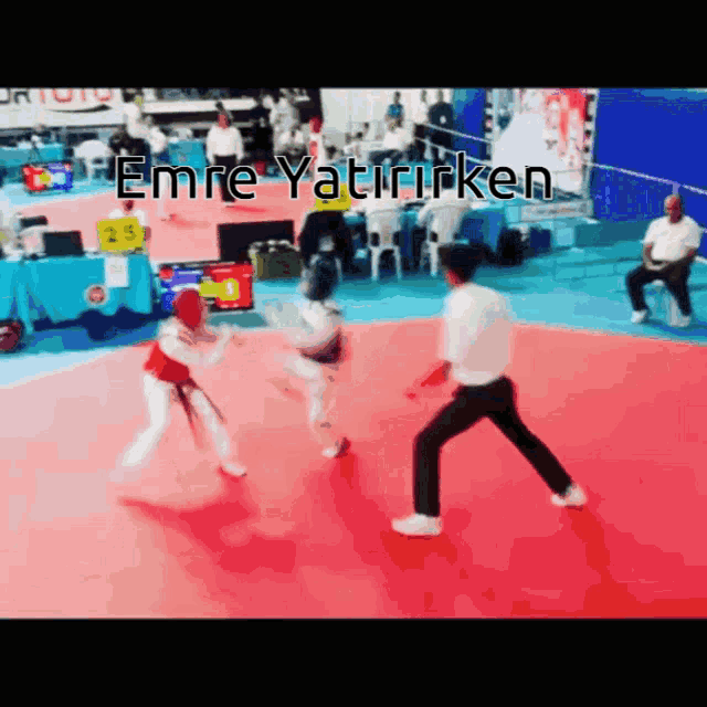 a karate match with the name emre written on the bottom right