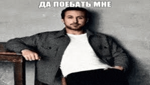 a man is sitting on a chair with his hands in his pockets and a foreign language .