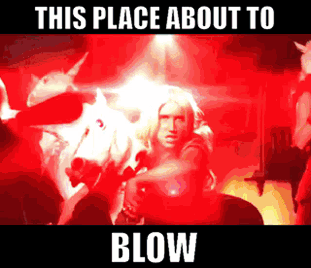 a woman stands in front of a bull with the words this place about to blow above her