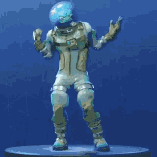 a statue of a man in a space suit is dancing on a blue background .