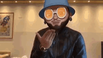 a man wearing a hat , sunglasses , and a beard is blowing a kiss .