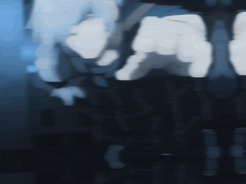 a blurred image of a person 's face with a few fingers pointing to the right