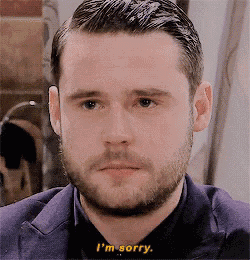 a man with a beard is saying i 'm sorry