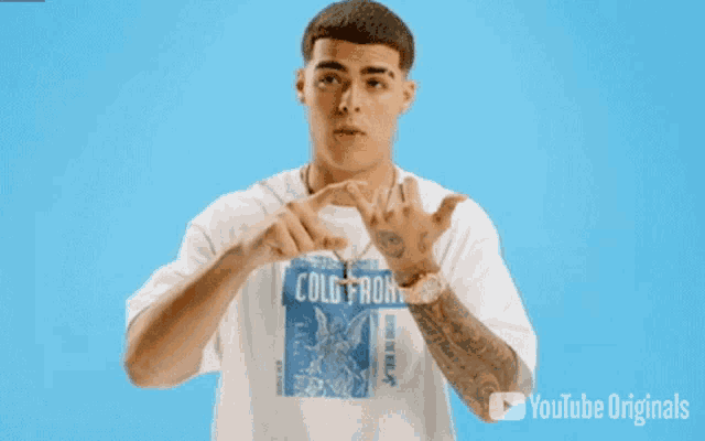 a man wearing a white t-shirt that says cold front