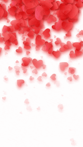 a white dove is holding a wedding ring in its beak in front of red hearts