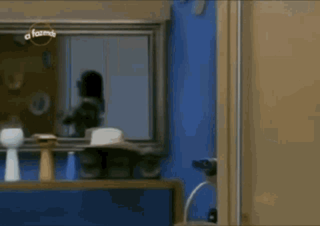 a cowboy hat is sitting on a shelf in front of a mirror with a fazenda logo on it