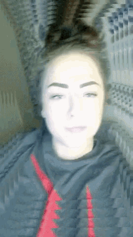 a blurry picture of a woman wearing a black shirt