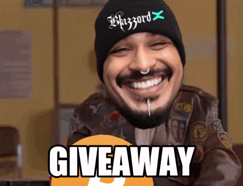 a man with a beard wearing a beanie that says blizzard