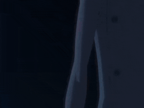 a close up of a person 's arm with a yellow light coming out of it .