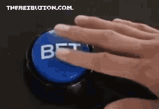 a person is pressing a button that says bet on it