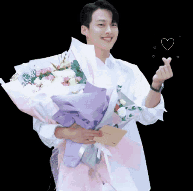 a man in a white shirt is holding a bouquet of flowers