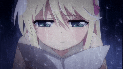 a girl with blonde hair and green eyes is reading a book