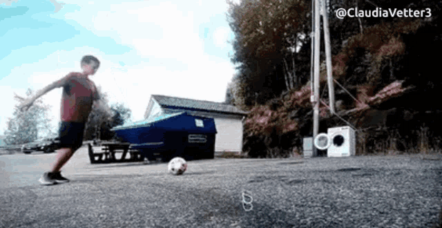 a boy is kicking a soccer ball with the hashtag @ claudiavetter3 at the bottom