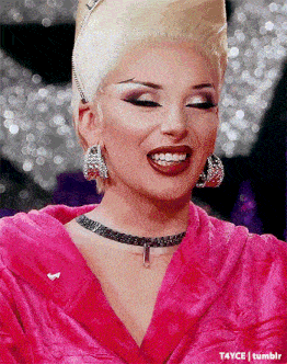 a close up of a woman wearing a pink robe and earrings with tumblr written on the bottom