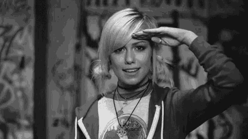 a black and white photo of a woman saluting