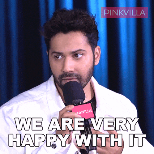 a man speaking into a microphone with the words " we are very happy with it " below him