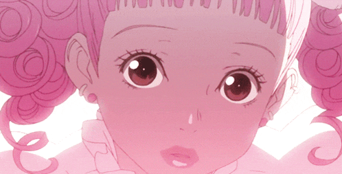 a close up of a girl 's face with pink hair and a white background