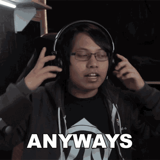 a man wearing headphones says anyways in white