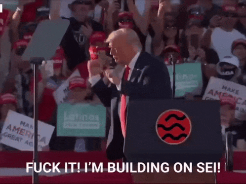 donald trump giving a speech in front of a crowd with a sign that says latinos for trump