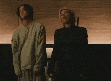 a man and a woman standing next to each other