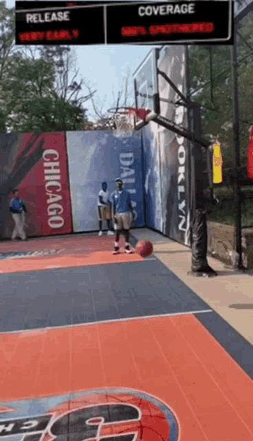 a man playing basketball on a court with a sign that says chicago on it