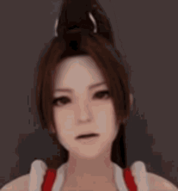 a close up of a woman 's face with a ponytail in her hair .