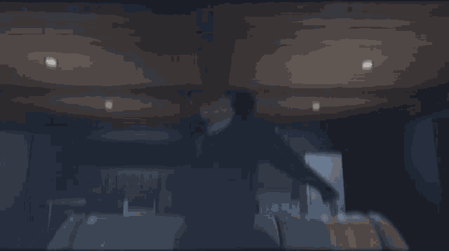 a man in a suit and tie wearing a mask