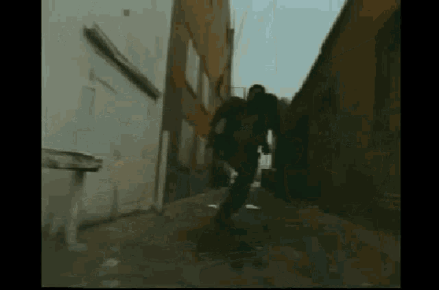 a person is running down a narrow alleyway between two buildings .