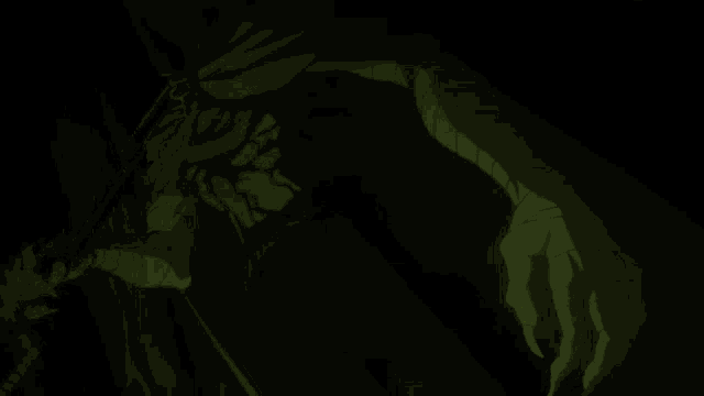 a close up of a person 's face with a green light coming out of it in the dark .